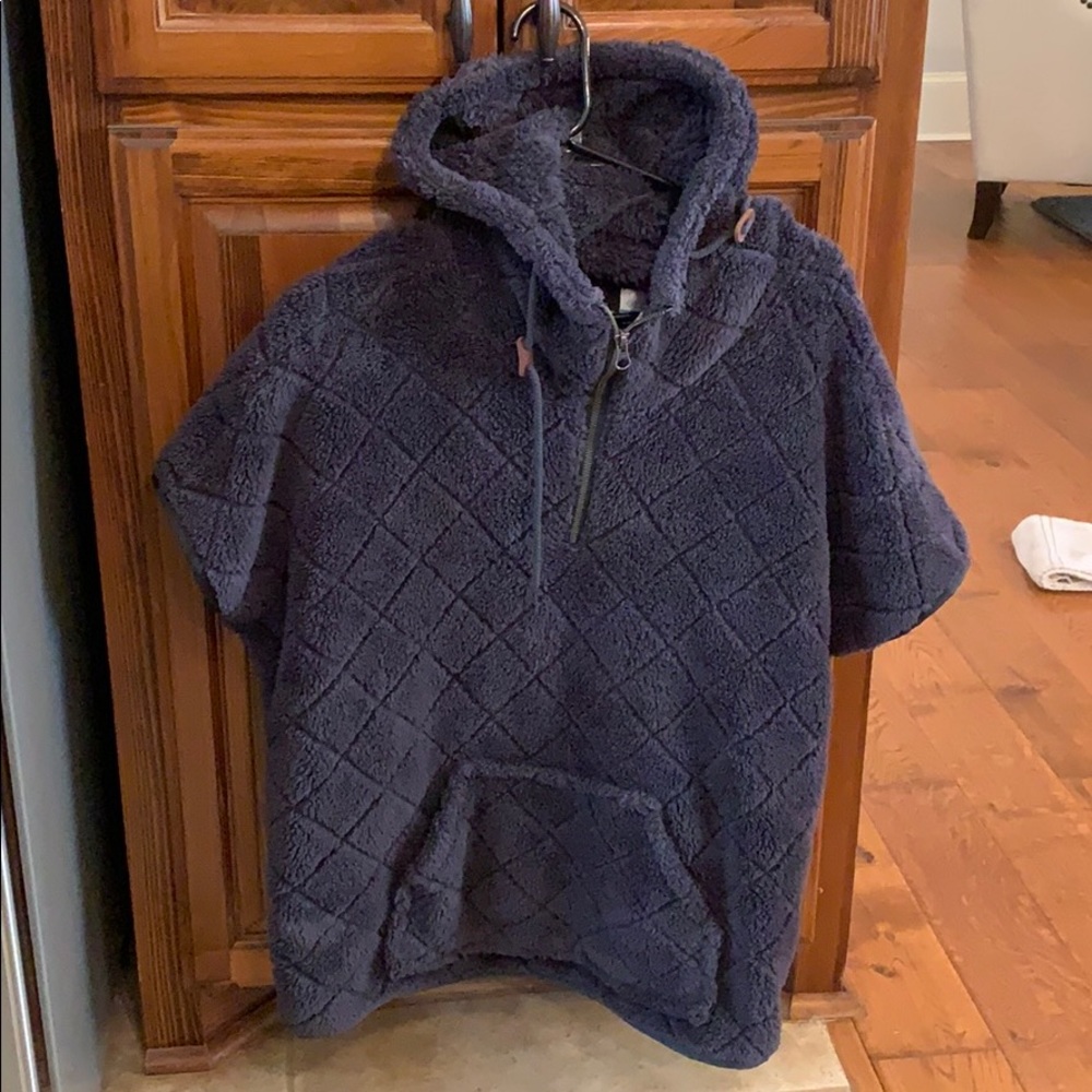 Colombia fire side Sherpa shrug.